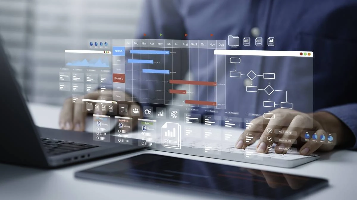 Une interface de planification de projet et des diagrammes superposés à un poste de travail